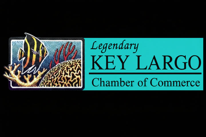 Logo of the Legendary Key Largo Chamber of Commerce with a fish and coral design on a black background.